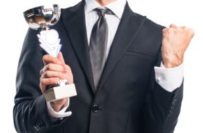 businessman-holding-trophy cut businessman-holding-trophy cut