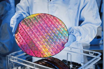 operator holds wafer semiconductor manufacturing