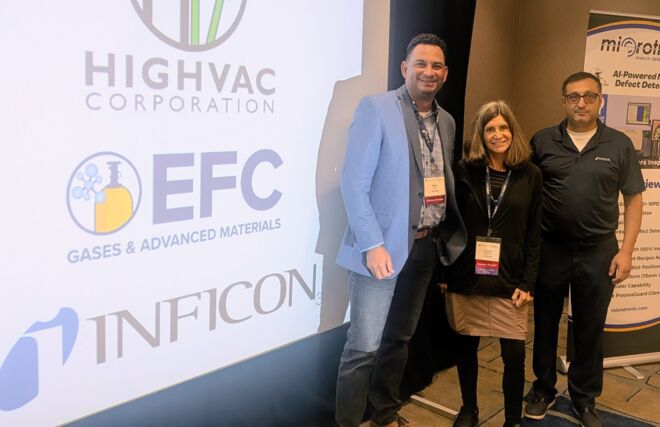 Inficon team at Q3 FOA meeting in front of sponsorship acknowledgement